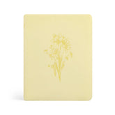 Beautiful Yellow Bible with a daffodil floral design on a white background