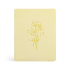 Beautiful Yellow Bible with a daffodil floral design on a white background