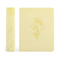 Two yellow Bibles with floral designs on a white background